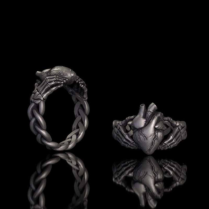 Gothic Skull Hands Holding Heart Sterling Silver Ring 01 | RoyalLuster.com