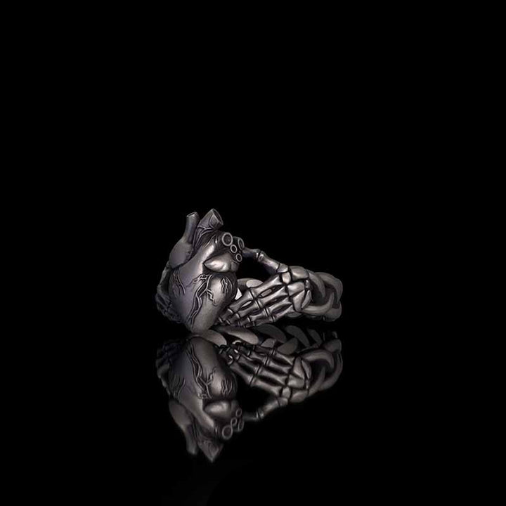 Gothic Skull Hands Holding Heart Sterling Silver Ring